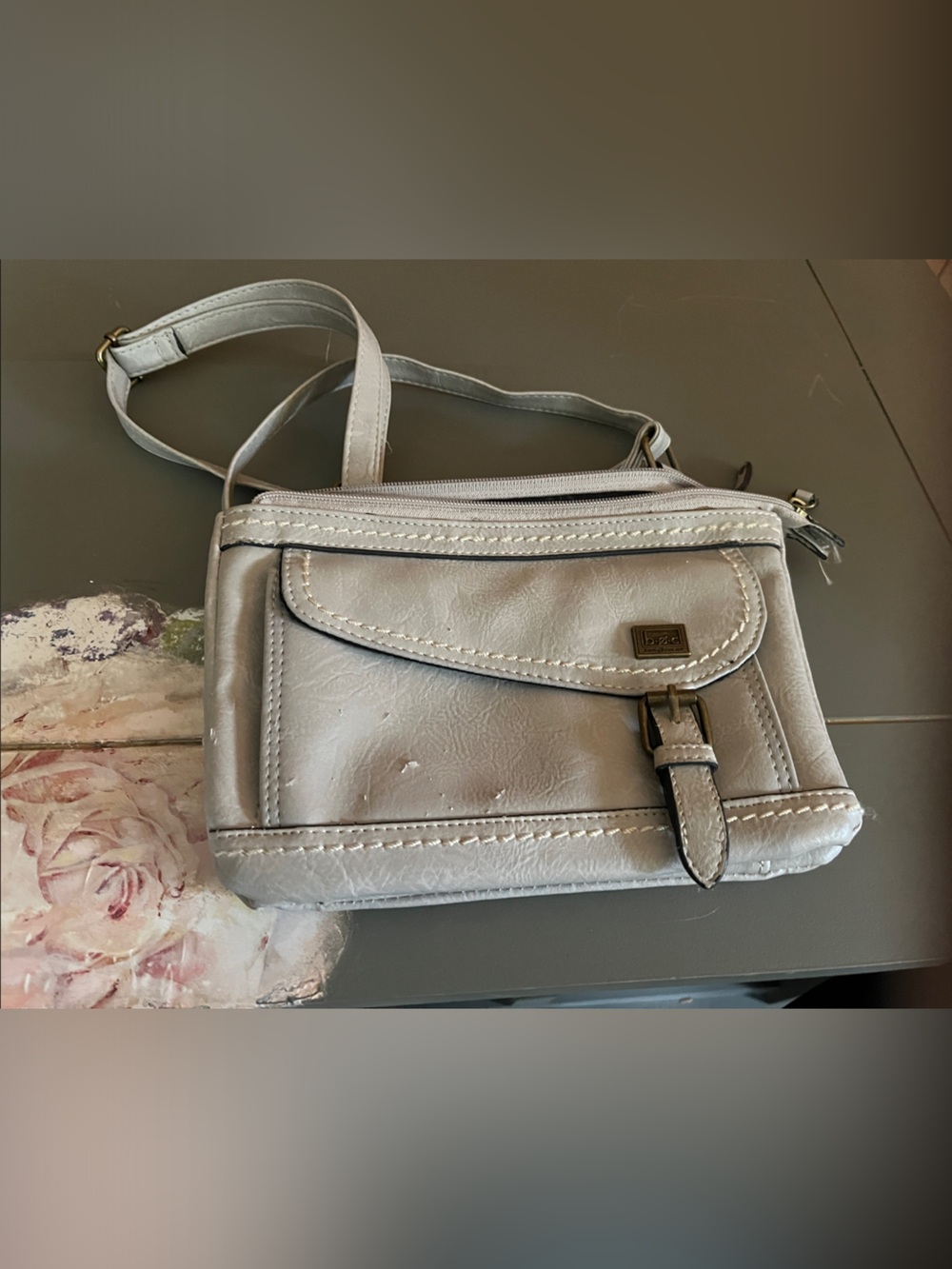 Versatile Silver Crossbody Bag with Front Flap and Buckle